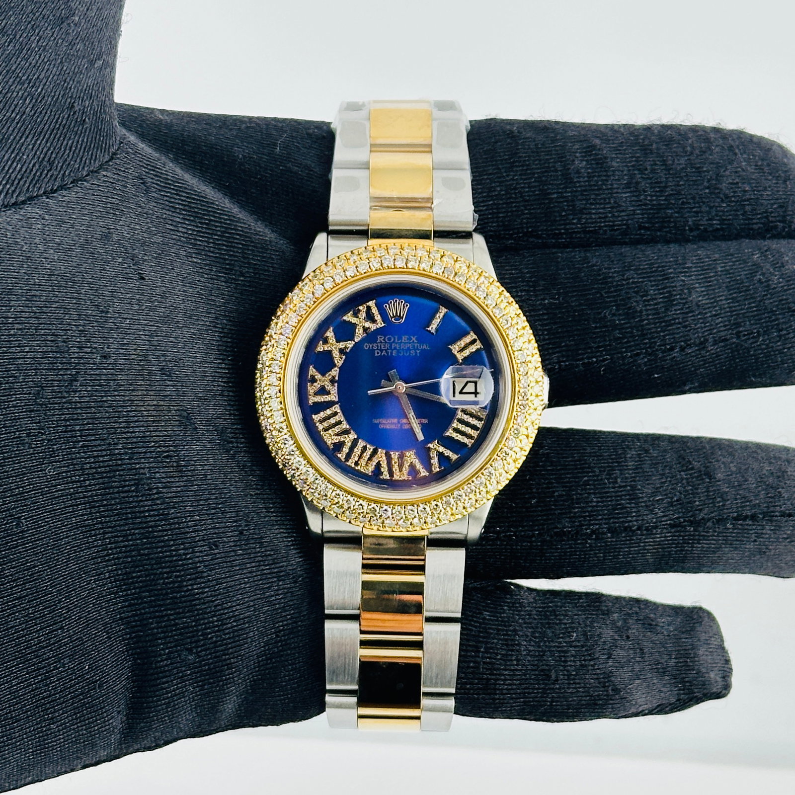 Rolex Datejust Ref 1601 Aftermarket Blue Roman Diamond Dial Oyster Bracelet: Rolex Datejust Ref 1601 Aftermarket Blue Roman Diamond Dial Oyster Bracelet This Rolex Datejust features an aftermarket blue Roman numeral dial adorned with diamond accents. The watch is equipped with