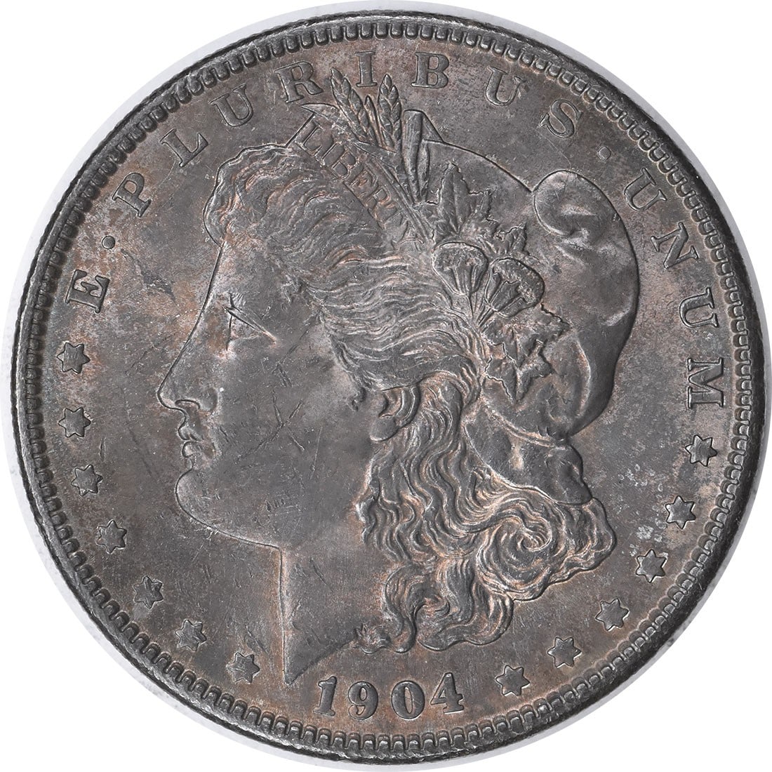 1904 Silver Morgan Dollar Choice BU Toned Uncertified US Coin: 1904 Silver Morgan Dollar Choice BU Toned Uncertified US Coin This 1904 Morgan Silver Dollar is a Choice Brilliant Uncirculated coin with attractive toning. It is uncertified, has no mint mark, and is