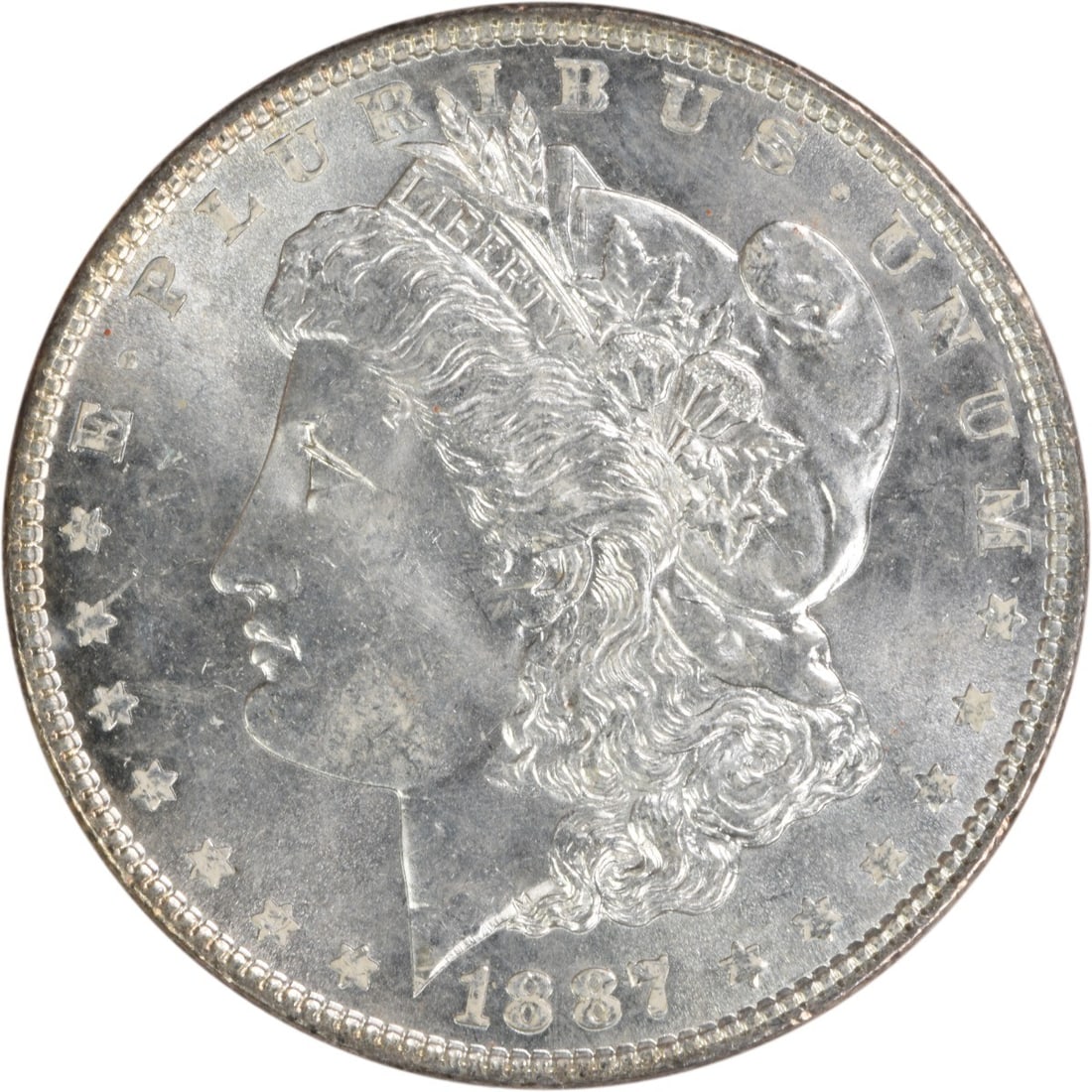 Choice BU 1887 Silver Dollar Morgan Uncirculated Uncertified Coin: Choice BU 1887 Silver Dollar Morgan Uncirculated Uncertified Coin This 1887 Morgan Silver Dollar is a choice brilliant uncirculated coin with no mint mark. It is composed of silver and originates from