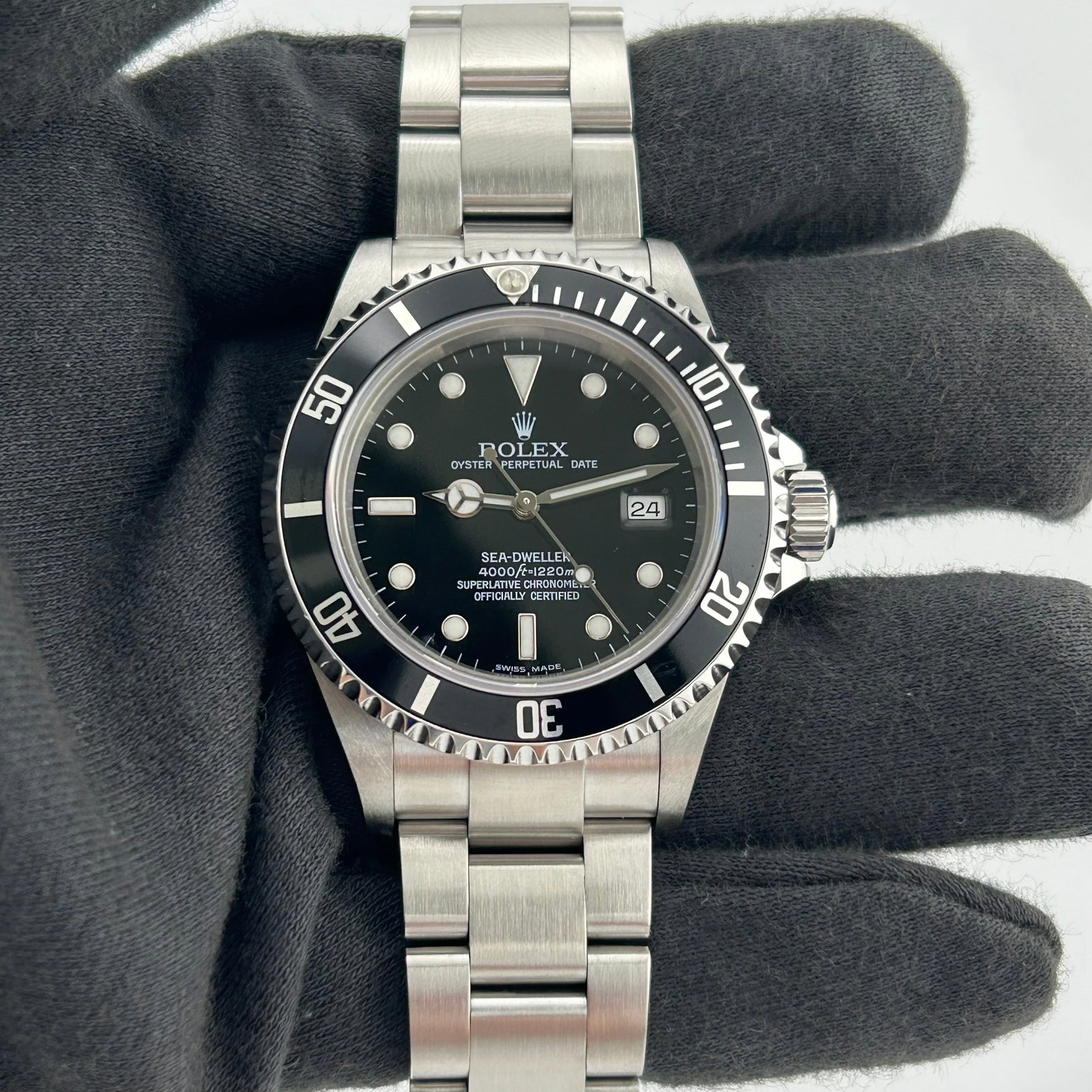 Rolex 16600 Sea-Dweller mens watch with black dial Oyster bracelet: Rolex 16600 Sea-Dweller mens watch with black dial Oyster bracelet Rolex Sea-Dweller men's watch with a black dial, rotating bezel, and Oyster bracelet. The watch is identified by reference number 166