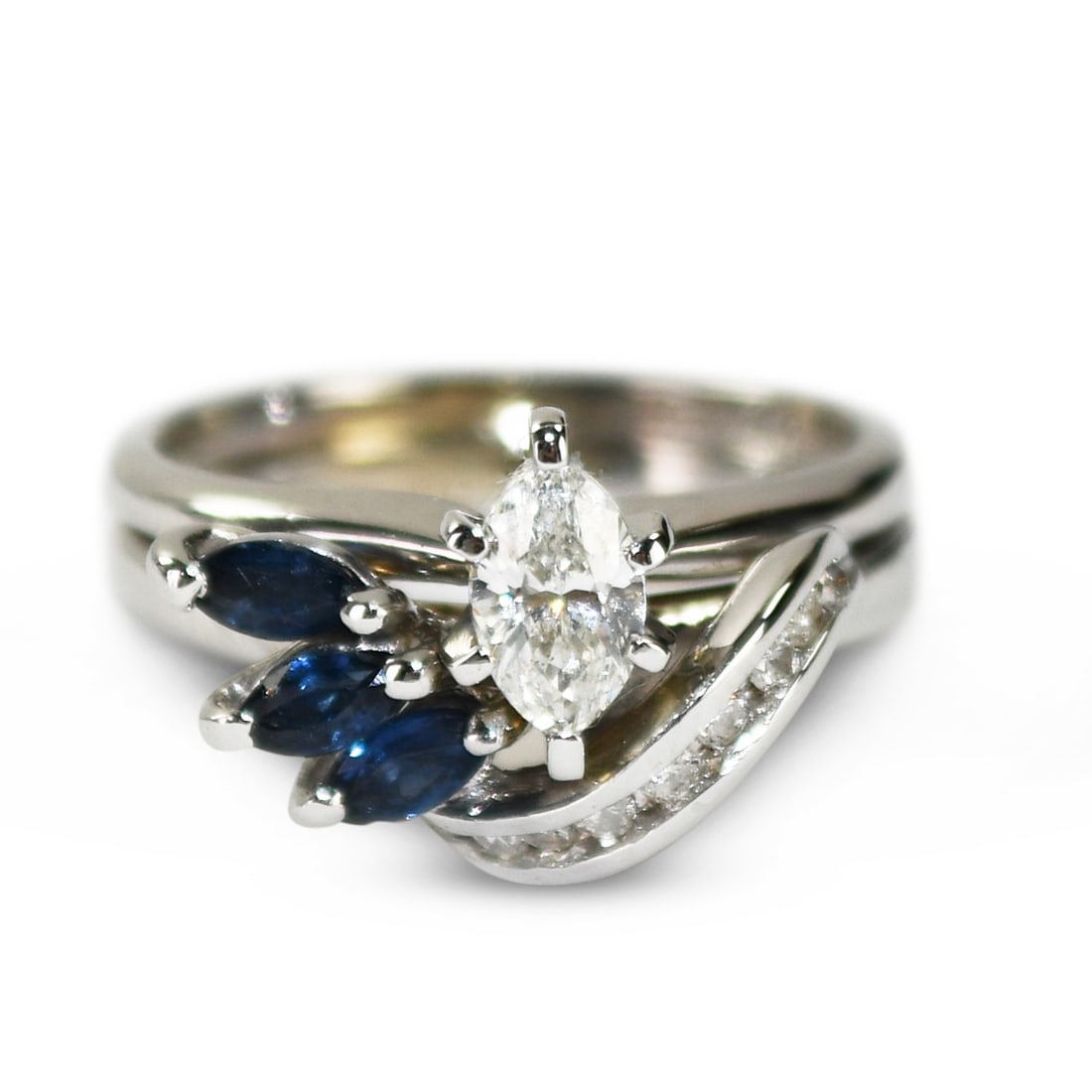 Vintage 14K White Gold Marquise Diamond Sapphire Cocktail Ring: Vintage 14K White Gold Marquise Diamond Sapphire Cocktail Ring This vintage cocktail ring features a marquise-shaped natural diamond at the center, weighing 0.33 carats with I color and SI clarity. Th