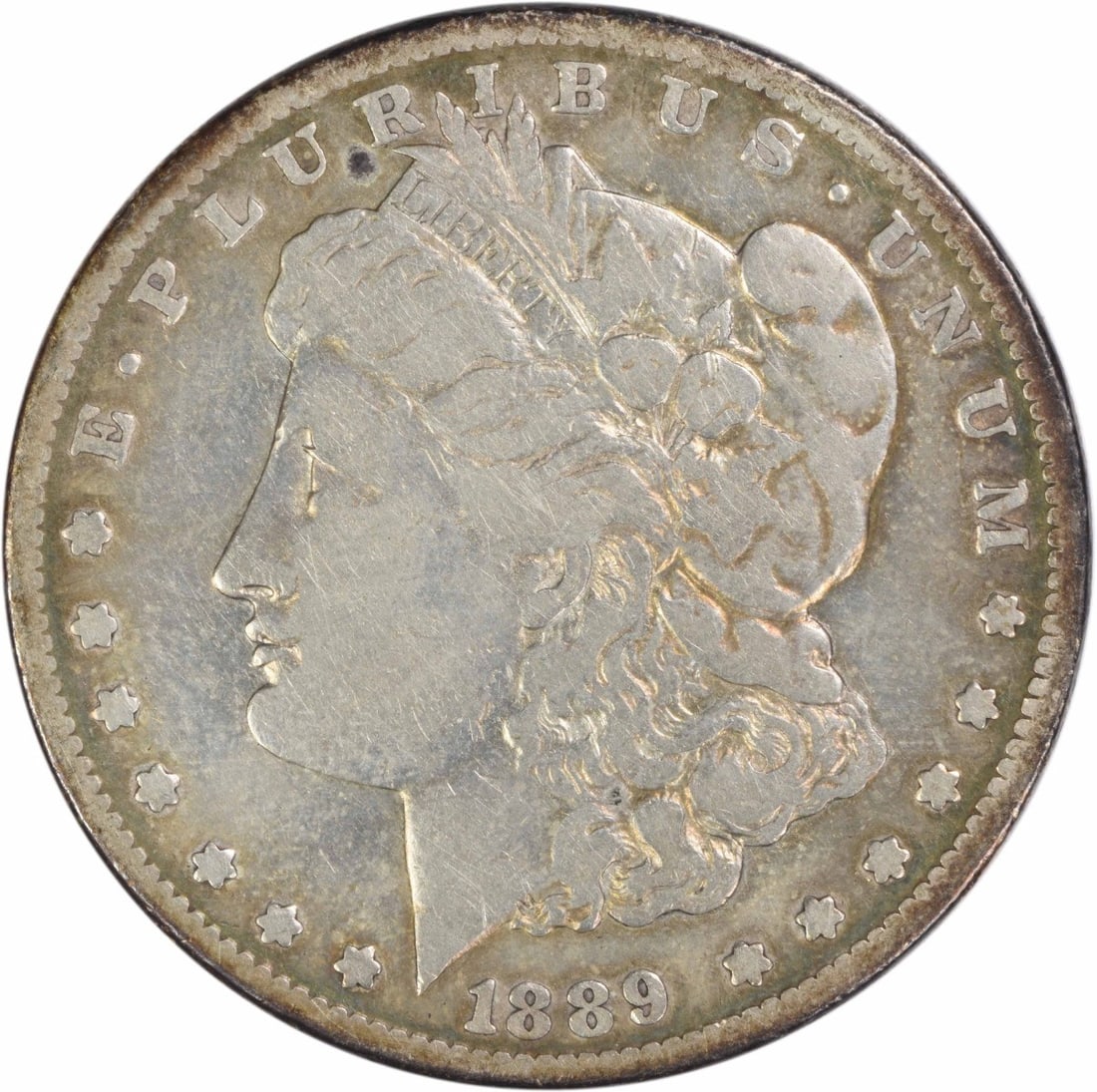 Carson City 1889 Morgan Dollar Fine Grade Uncertified Silver Coin: Carson City 1889 Morgan Dollar Fine Grade Uncertified Silver Coin This is an 1889-CC Morgan Silver Dollar from the Carson City Mint. The coin is composed of 90% silver and 10% copper, and features the