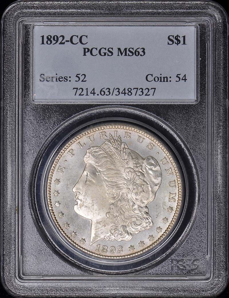 PCGS MS63 Morgan Dollar 1892 Carson City Mint Silver Coin: PCGS MS63 Morgan Dollar 1892 Carson City Mint Silver Coin This is an 1892-CC Morgan Dollar graded MS63 by PCGS. The coin was minted in Carson City and is uncirculated. It is a pre-owned collectible. S