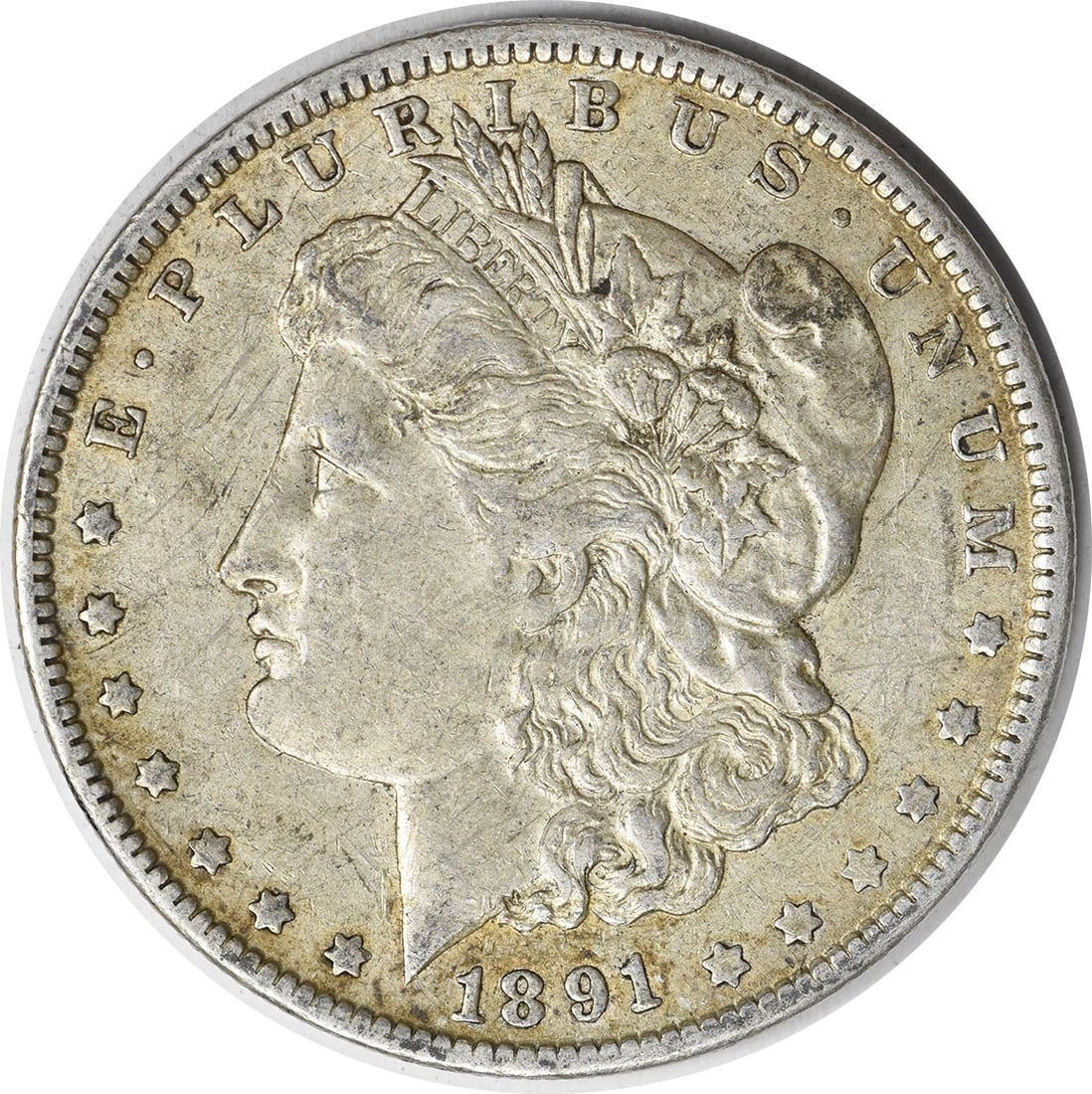1891-O Morgan Silver Dollar Uncertified 90% Silver Coin: 1891-O Morgan Silver Dollar Uncertified 90% Silver Coin This 1891-O Morgan Silver Dollar is an exquisite piece for any coin collector. Featuring a composition of 90% Silver and 10% Copper, this circul