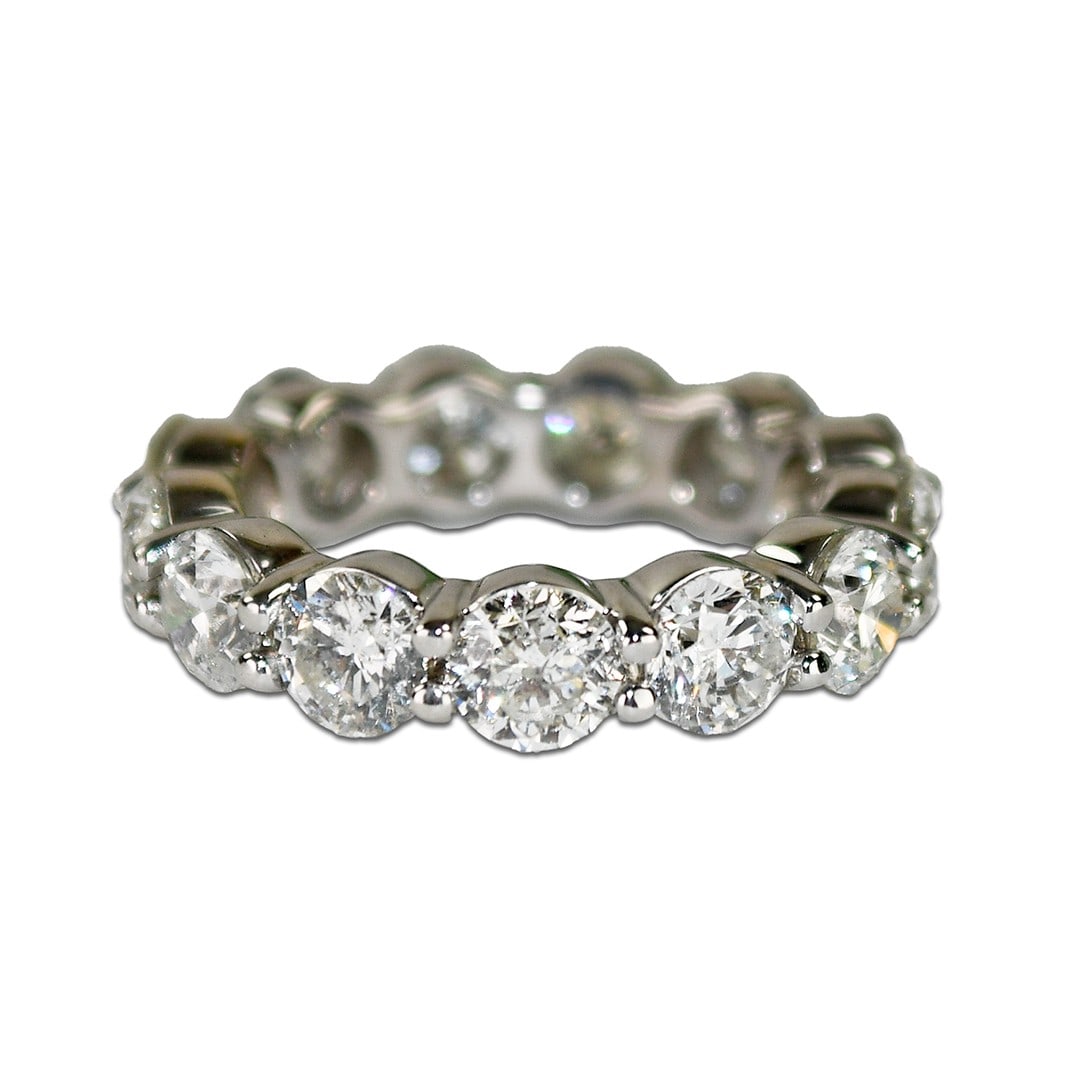 18K White Gold Eternity Diamond Ring Size 5.5: 18K White Gold Eternity Diamond Ring Size 5.5 This pre-owned eternity ring features round brilliant natural diamonds set in 18K white gold. The ring is stamped 18K and confirmed to be 75% gold using a