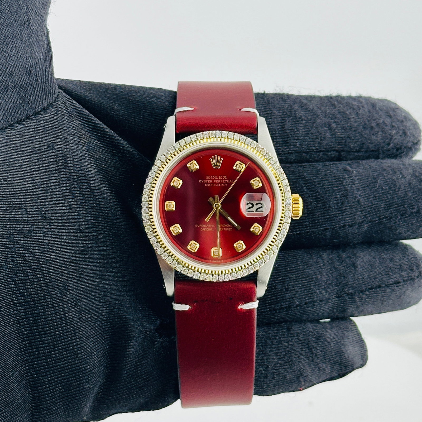 Rolex Datejust Ref 1601 Watch With Aftermarket Red Yellow Diamond Dial and Aftermarket Leather Strap: Rolex Datejust Ref 1601 Watch With Aftermarket Red Yellow Diamond Dial and Aftermarket Leather Strap This men's Rolex Datejust features an aftermarket red and yellow dial with diamond markers, complem