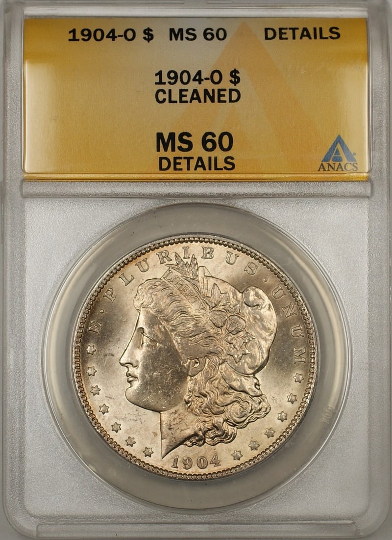 ANACS MS60 Details Cleaned 1904-O Morgan Silver Dollar: ANACS MS60 Details Cleaned 1904-O Morgan Silver Dollar This 1904-O Morgan Silver Dollar is graded MS-60 Details by ANACS and has been noted as cleaned. Minted in New Orleans, this uncirculated coin is