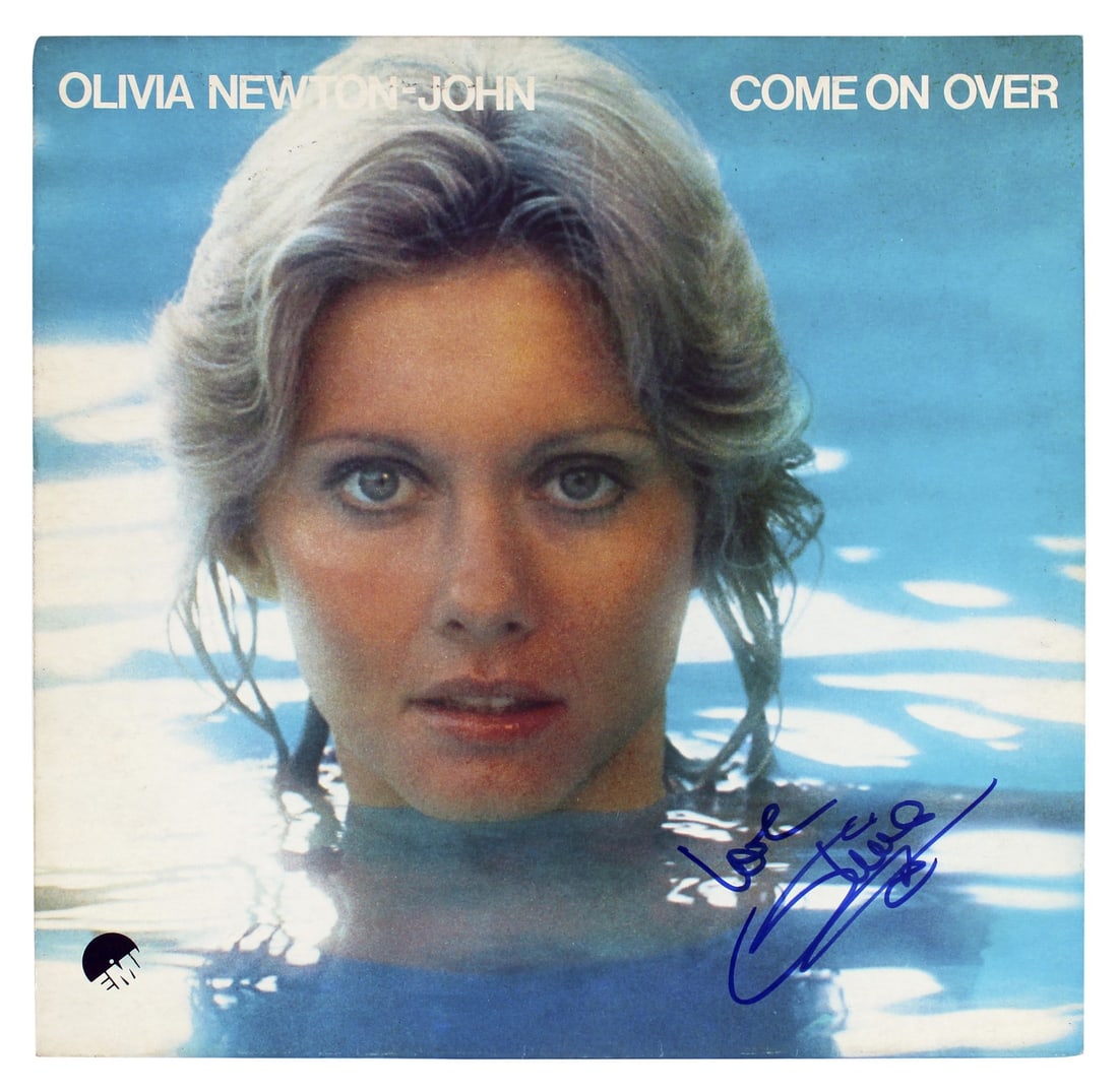 Beckett BAS Olivia Newton John signed Come On Over album cover Love inscription: Beckett BAS Olivia Newton John signed Come On Over album cover Love inscription Autographed Come On Over album cover without vinyl, personally signed by Olivia Newton John with the inscription "Love."