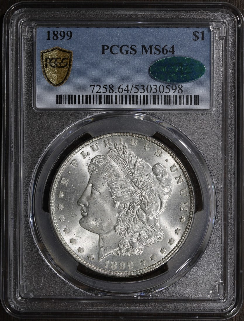PCGS MS64 CAC 1899 Morgan Silver Dollar Key Date: PCGS MS64 CAC 1899 Morgan Silver Dollar Key Date This is an 1899 Morgan Silver Dollar graded MS64 by PCGS. The coin is uncirculated and features a CAC sticker, indicating additional quality assurance.