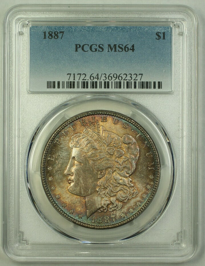 PCGS MS-64 1887 Morgan Dollar Obverse Toned: PCGS MS-64 1887 Morgan Dollar Obverse Toned This 1887 Morgan Silver Dollar features a $1 denomination and is graded MS-64 by PCGS. The coin is uncirculated and displays attractive toning on the obvers