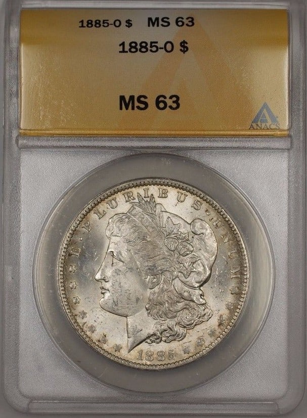 ANACS MS-63 1885-O Morgan $1 Silver Dollar: ANACS MS-63 1885-O Morgan $1 Silver Dollar This is an 1885-O Morgan Silver Dollar graded MS-63 by ANACS. Minted in New Orleans, this uncirculated coin is composed of 90% silver and represents a classi