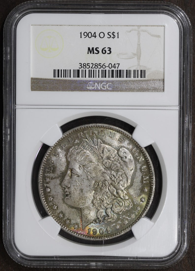 NGC MS63 1904-O Morgan Dollar Silver Coin with Vibrant Toning: NGC MS63 1904-O Morgan Dollar Silver Coin with Vibrant Toning This 1904-O Morgan Silver Dollar features a colorful tone and has been certified by NGC with a grade of MS63. Struck in New Orleans, this 