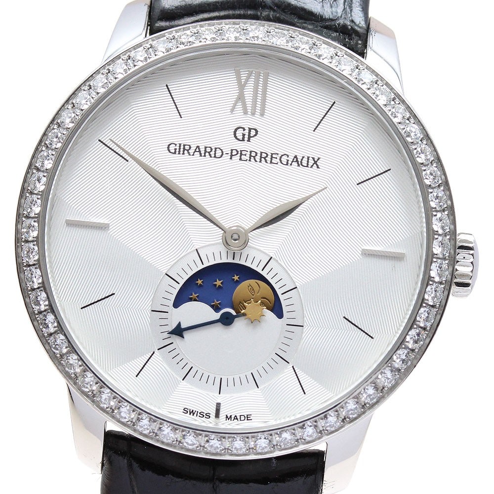 Girard Perregaux 49524 Automatic Moon Phase Steel Watch: Girard Perregaux 49524 Automatic Moon Phase Steel Watch This Girard Perregaux 49524 men's wristwatch features a stainless steel case paired with a leather strap and a silver dial. The automatic moveme