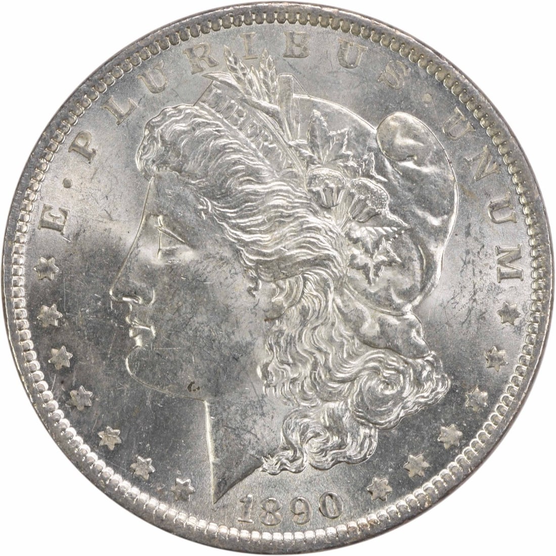 1890 Silver Morgan Dollar Brilliant Uncirculated Uncertified No Mint Mark: 1890 Silver Morgan Dollar Brilliant Uncirculated Uncertified No Mint Mark This 1890 Morgan Silver Dollar is a brilliant uncirculated example, featuring no mint mark and composed of silver. It is uncer