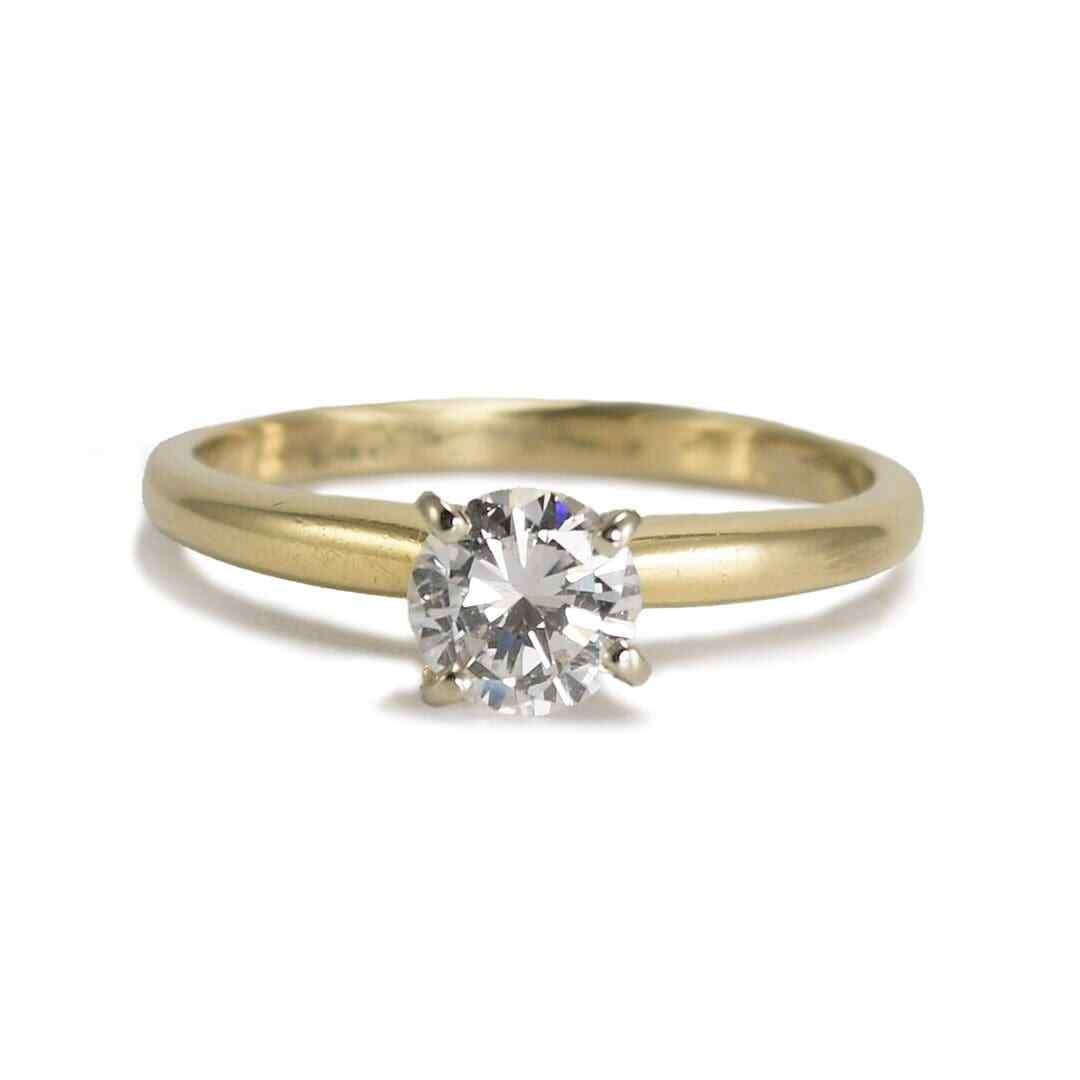 Round 0.57ct Diamond Prong Ring 14K Yellow Gold Size 6.5: Round 0.57ct Diamond Prong Ring 14K Yellow Gold Size 6.5 This elegant engagement ring features a round brilliant cut diamond solitaire set in a classic Tiffany-style prong setting. Crafted from 14k ye