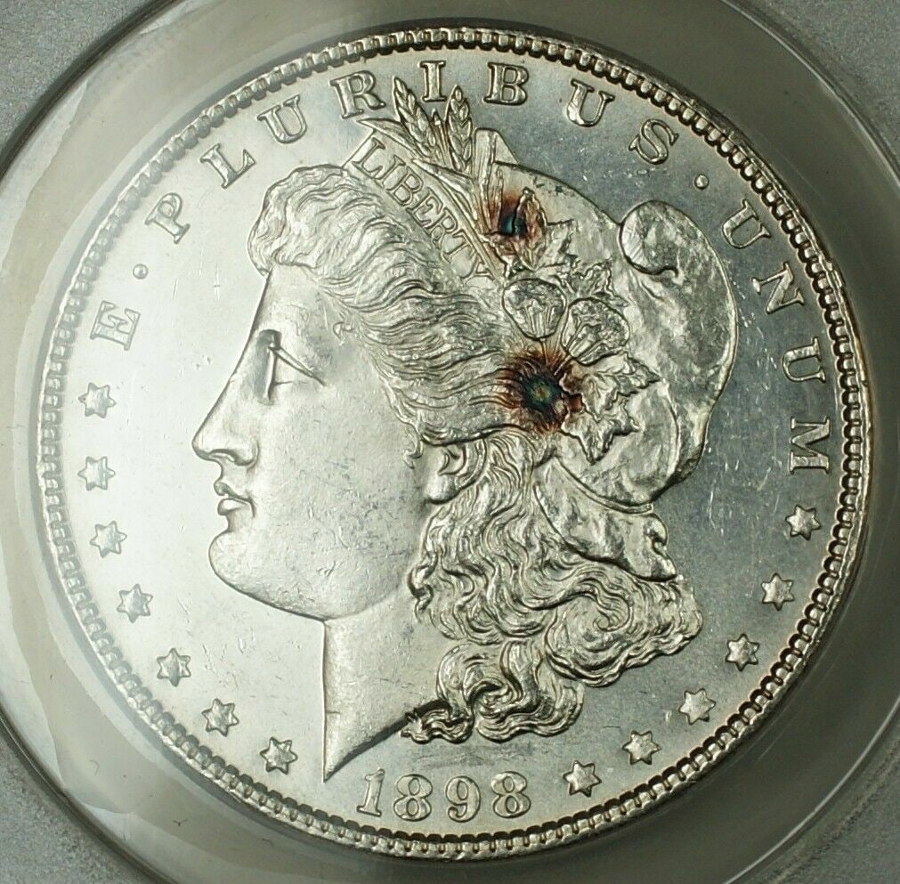 ANACS MS-62 1898 Morgan Dollar Philadelphia Mint: ANACS MS-62 1898 Morgan Dollar Philadelphia Mint This 1898 Morgan Silver Dollar is certified by ANACS with a grade of MS-62, indicating a quality uncirculated coin. Struck at the Philadelphia Mint, it