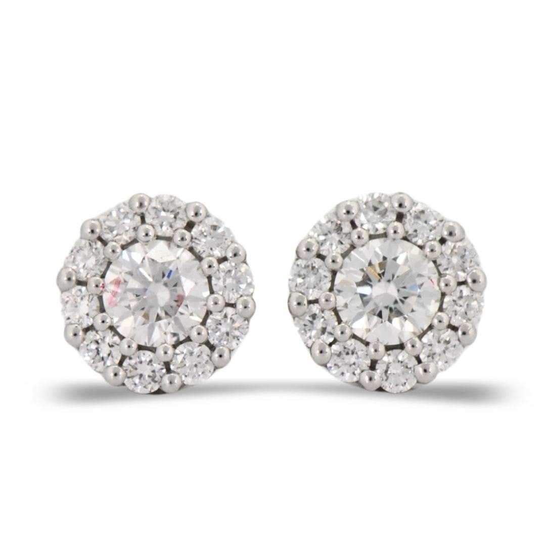 14K White Gold Round Diamond Cluster Earrings: 14K White Gold Round Diamond Cluster Earrings These stud earrings feature a classic cluster design crafted in 14K white gold. Each earring is set with round brilliant cut natural diamonds totaling 0.4