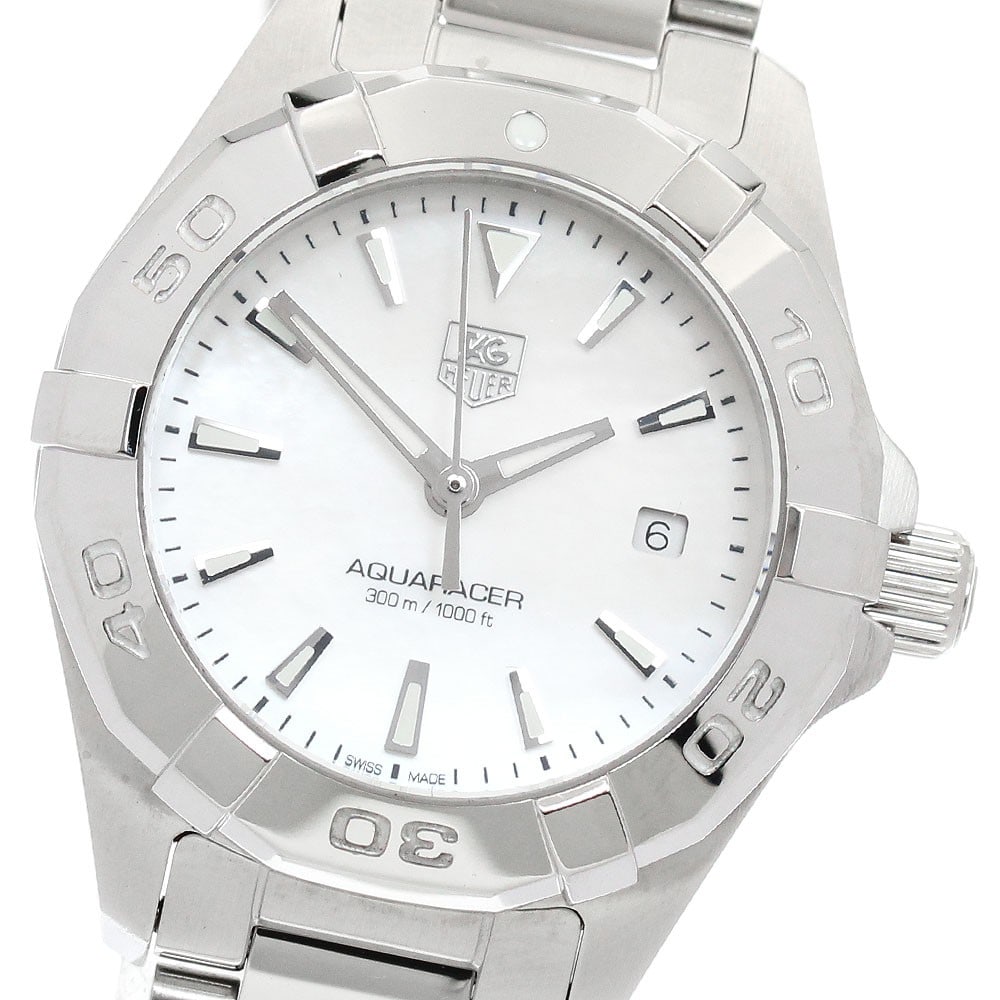 TAG Heuer Aquaracer Quartz Ladies Date Watch Stainless Steel: TAG Heuer Aquaracer Quartz Ladies Date Watch Stainless Steel This TAG Heuer Aquaracer Date Quartz women's wristwatch features a stainless steel case and bracelet, complemented by a white mother-of-pea
