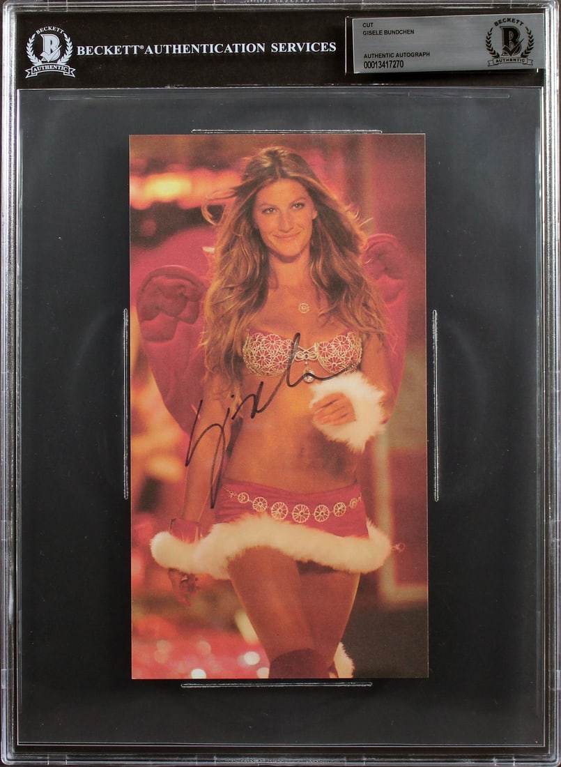Gisele Bundchen Beckett Authenticated 4.5x8.5 Slabbed Autograph Cut: Gisele Bundchen Beckett Authenticated 4.5x8.5 Slabbed Autograph Cut This 4.5x8.5 cut signature features the authentic autograph of Gisele Bundchen. The item comes slabbed and has been authenticated by