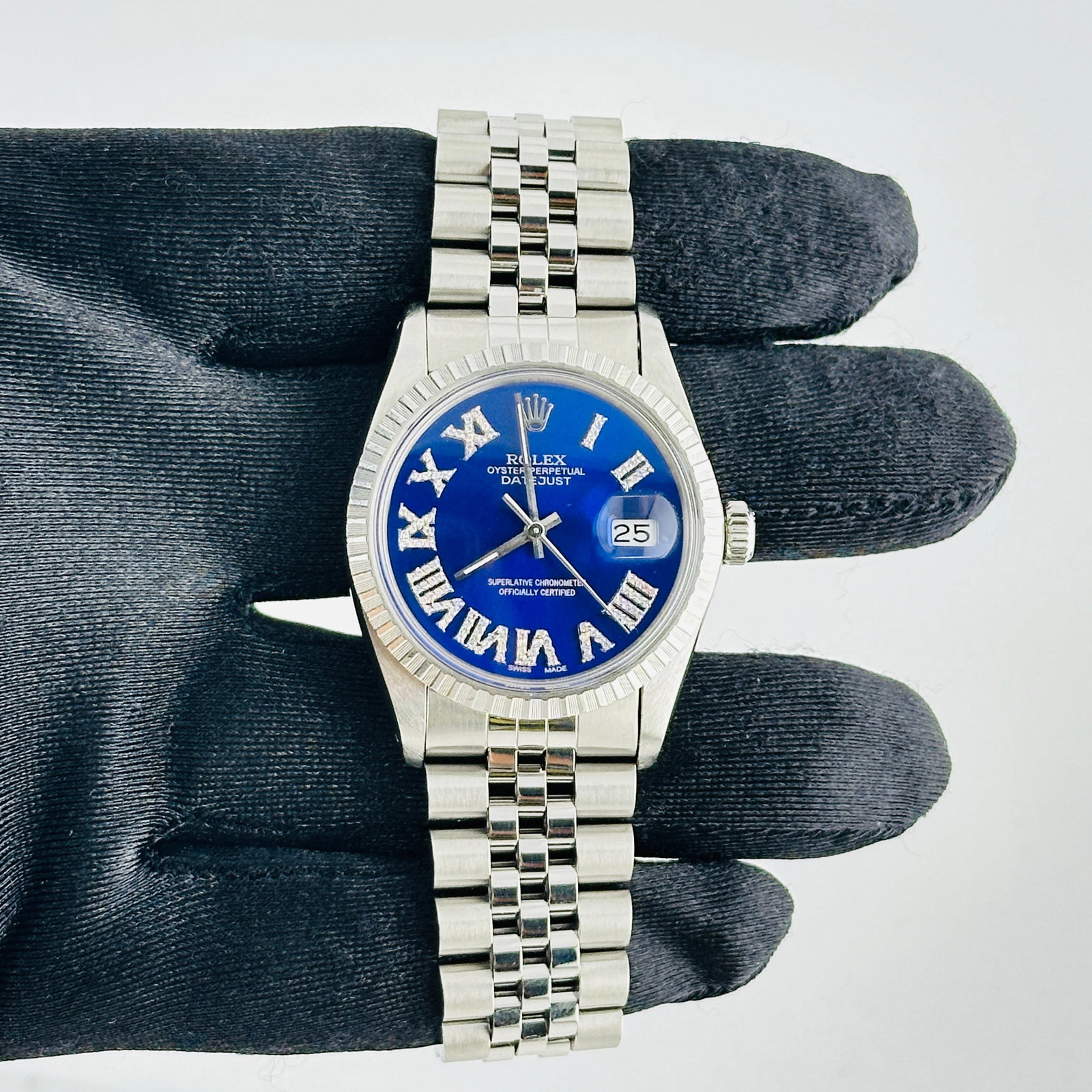 Rolex Datejust Ref 16030 Mens Watch aftermarket Blue Roman Diamond Dial: Rolex Datejust Ref 16030 Mens Watch aftermarket Blue Roman Diamond Dial This Rolex Datejust features a silver dial and an engine-turned bezel, complemented by a D-Link Jubilee bracelet. The watch is i