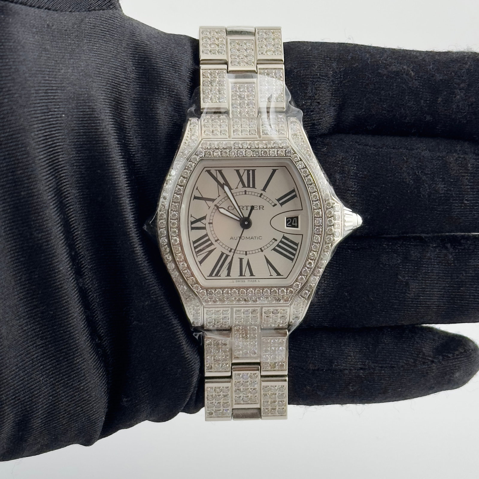 Cartier Roadster 3312 Mens Watch Silver Roman Diamond Bezel and Bracelet: Cartier Roadster 3312 Mens Watch Silver Roman Diamond Bezel and Bracelet This Cartier Roadster watch features a silver Roman numeral dial, a diamond bezel, and a diamond bracelet. Designed for men, it