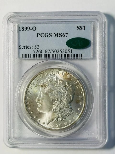 PCGS CAC 1899-O Morgan Silver Dollar MS-67: PCGS CAC 1899-O Morgan Silver Dollar MS-67 This 1899 Morgan Silver Dollar was minted in New Orleans and is graded MS-67 by PCGS, with CAC approval for quality assurance. The coin is composed of silver
