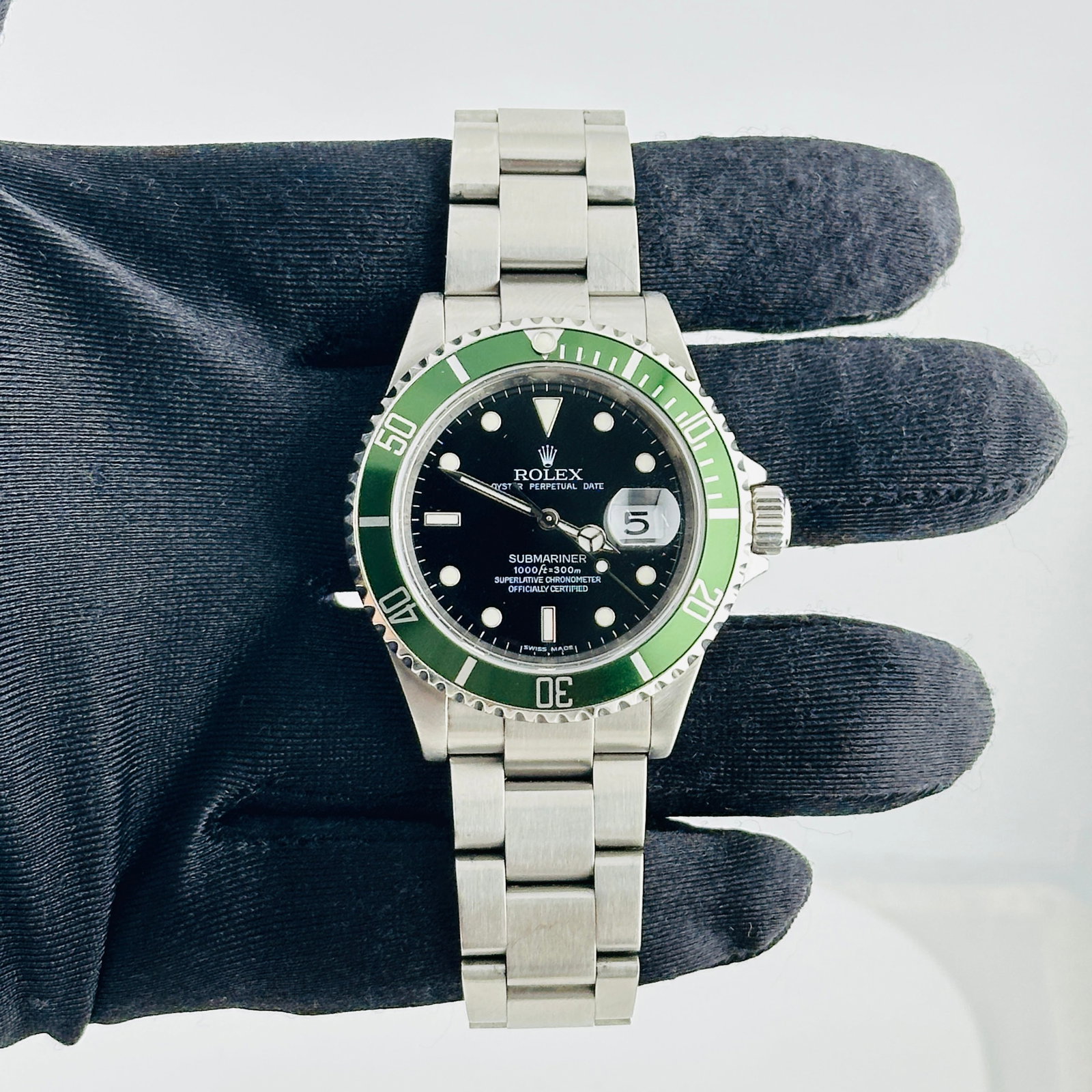 Rolex 16610T Submariner Date mens watch black dial aftermarket bezel insert: Rolex 16610T Submariner Date mens watch black dial aftermarket bezel insert Rolex Submariner Date wristwatch featuring a black dial, aluminum bezel with Aftermarket insert, and Oyster bracelet. This m