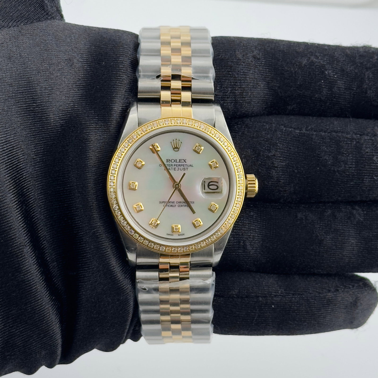 Rolex Datejust 1601 White MOP Diamond Marker Dial Jubilee Bracelet: Rolex Datejust 1601 White MOP Diamond Marker Dial Jubilee Bracelet This men's Rolex Datejust features an aftermarket white mother of pearl dial with yellow diamond markers and an aftermarket Jubilee b