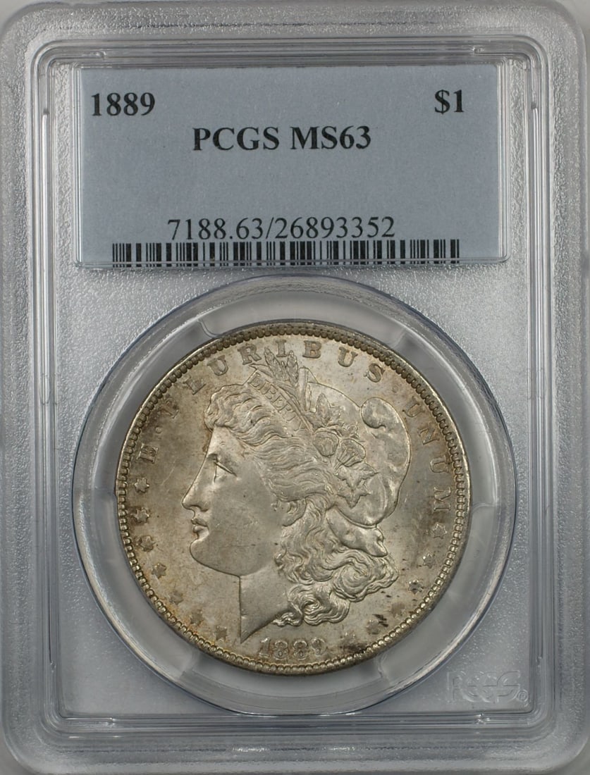 PCGS MS63 1889 Morgan silver dollar light toning: PCGS MS63 1889 Morgan silver dollar light toning This 1889 Morgan Silver Dollar is graded MS-63 by PCGS, indicating a well-preserved, uncirculated coin with only minor marks. It features light toning 