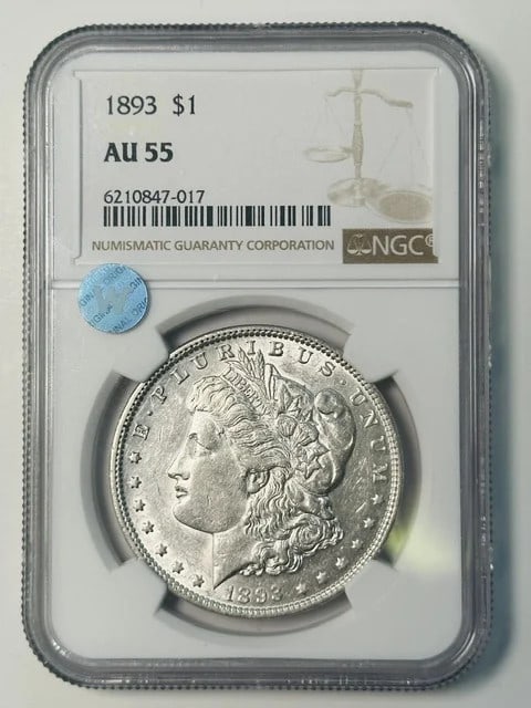 NGC AU55 1893 Morgan Dollar Silver: NGC AU55 1893 Morgan Dollar Silver This 1893 Morgan Silver Dollar has been graded AU-55 by NGC, indicating it is in About Uncirculated condition. Composed of silver, this pre-owned coin originates fro
