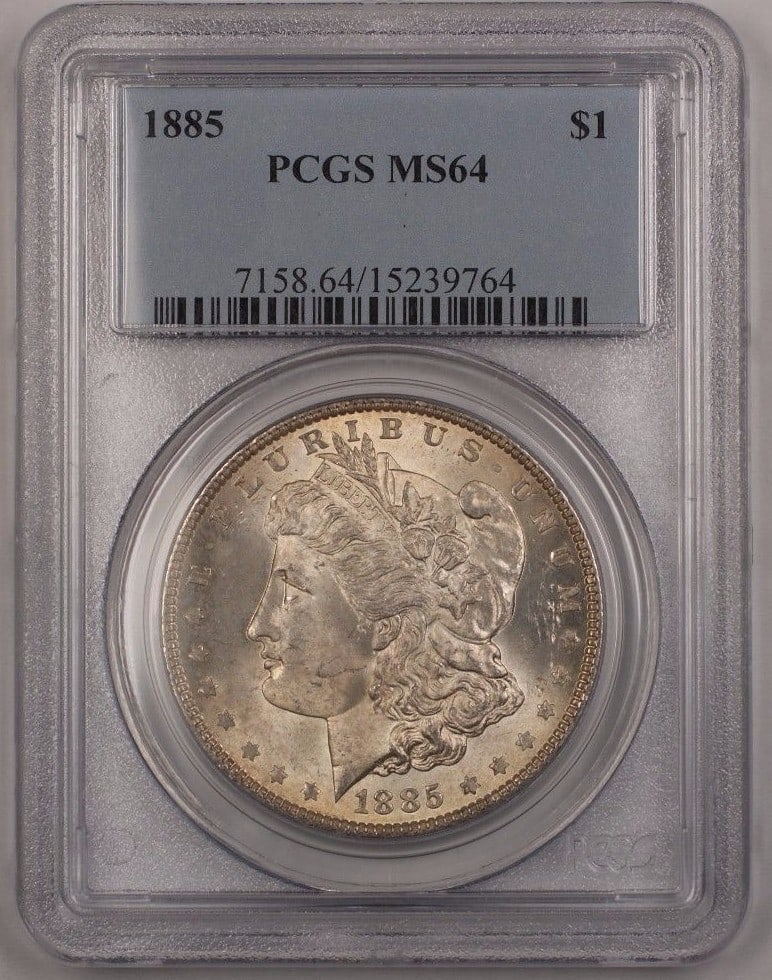 1885 Philadelphia Silver Dollar Morgan $1 PCGS MS64 Light Toning: 1885 Philadelphia Silver Dollar Morgan $1 PCGS MS64 Light Toning This 1885 US Morgan Silver Dollar is certified by PCGS with a grade of MS 64, indicating its uncirculated condition. The coin features 