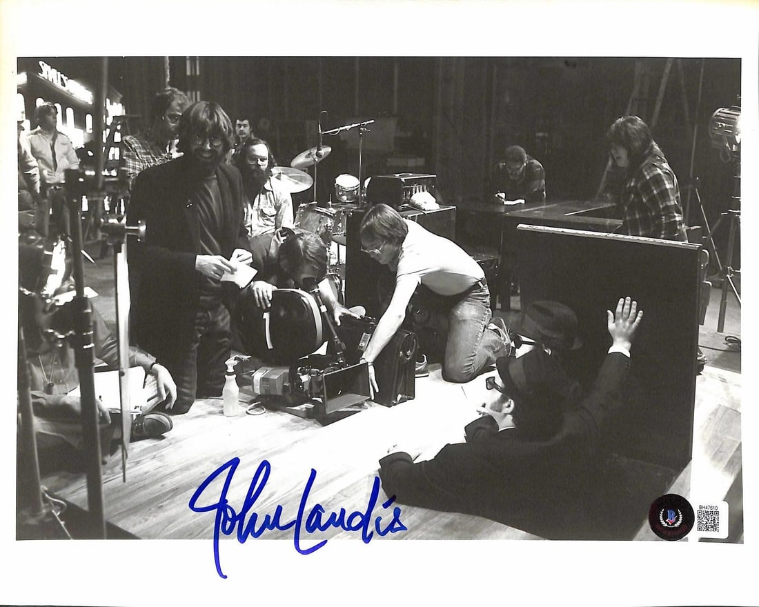 Beckett Authenticated 8x10 Blues Brothers Photo Signed by John Landis: Beckett Authenticated 8x10 Blues Brothers Photo Signed by John Landis This is a black-and-white 8x10 behind-the-scenes photograph from the production of The Blues Brothers, hand-signed by director Joh