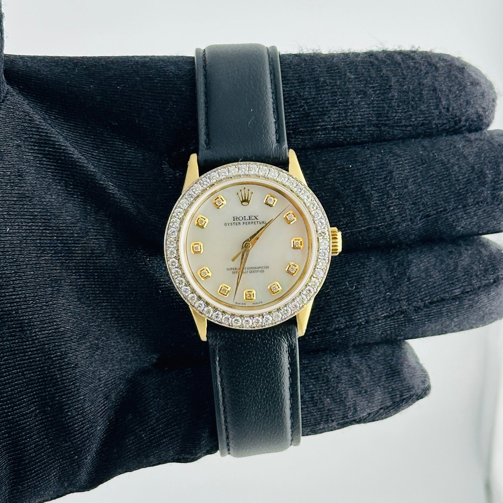 Rolex Oyster Perpetual 6548 Aftermarket White MOP Diamond Dial Leather Band: Rolex Oyster Perpetual 6548 Aftermarket White MOP Diamond Dial Leather Band This Rolex Oyster Perpetual watch features an aftermarket white mother-of-pearl diamond dial, a pave diamond stainless steel