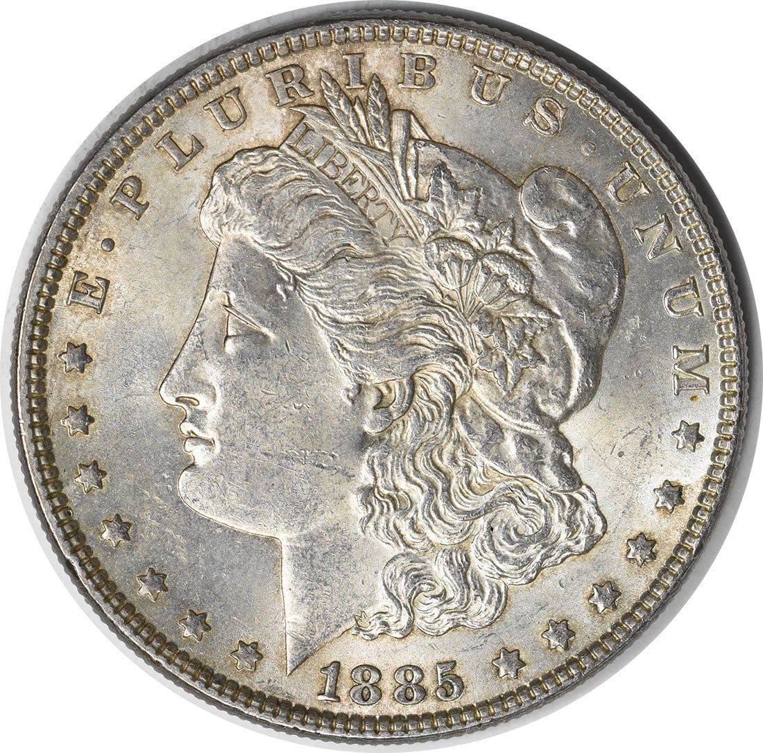 Choice BU 1885 Silver Morgan Dollar With Toned Finish Uncertified: Choice BU 1885 Silver Morgan Dollar With Toned Finish Uncertified This 1885 Morgan Silver Dollar is a Choice Brilliant Uncirculated (BU) coin. It features attractive toning and has not been certified 