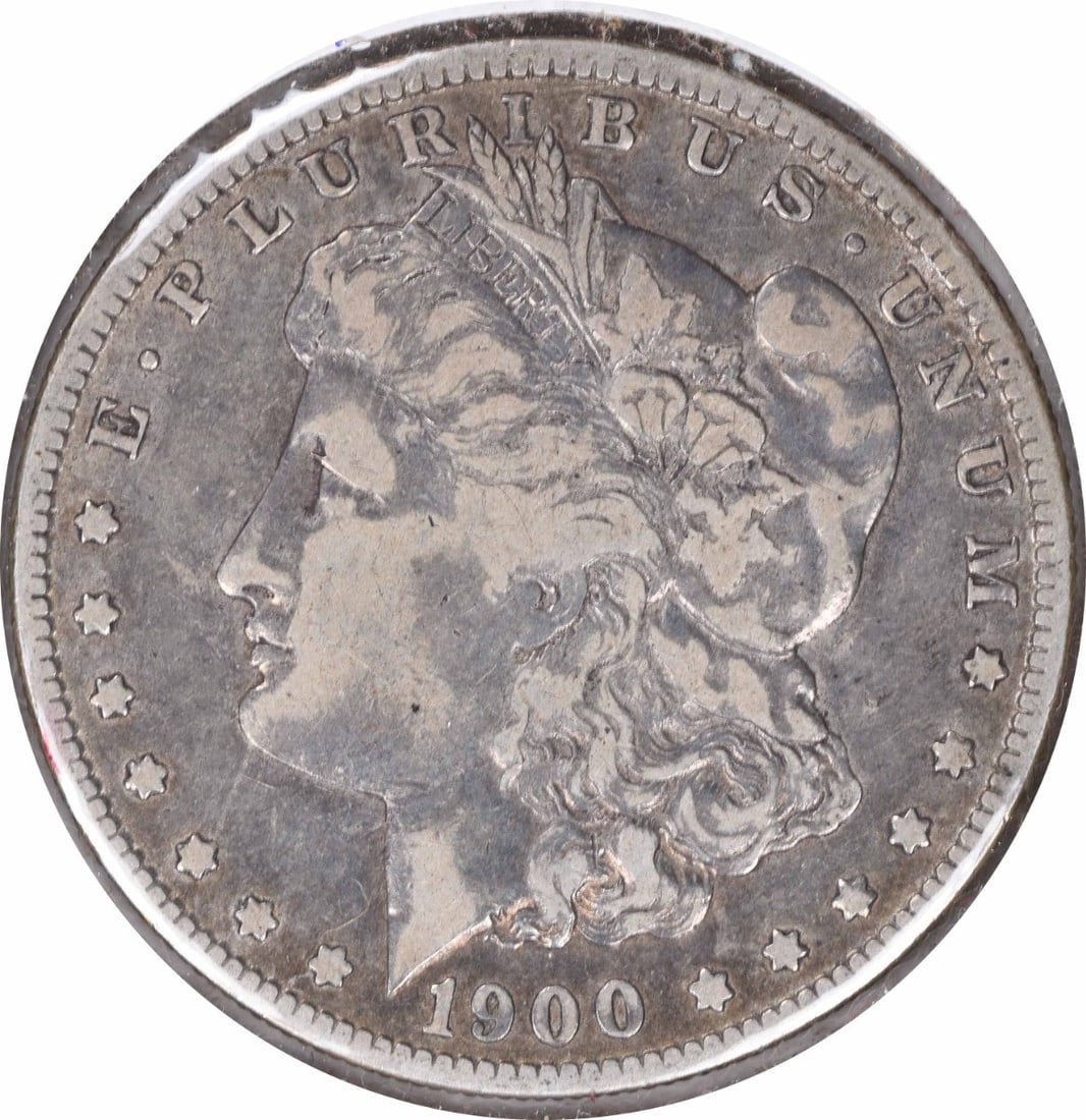 1900-O Morgan Silver Dollar VF Uncertified 90% Silver Coin: 1900-O Morgan Silver Dollar VF Uncertified 90% Silver Coin This 1900-O/CC Morgan Silver Dollar showcases a striking design by George T. Morgan and is a notable piece from the New Orleans mint. The coi