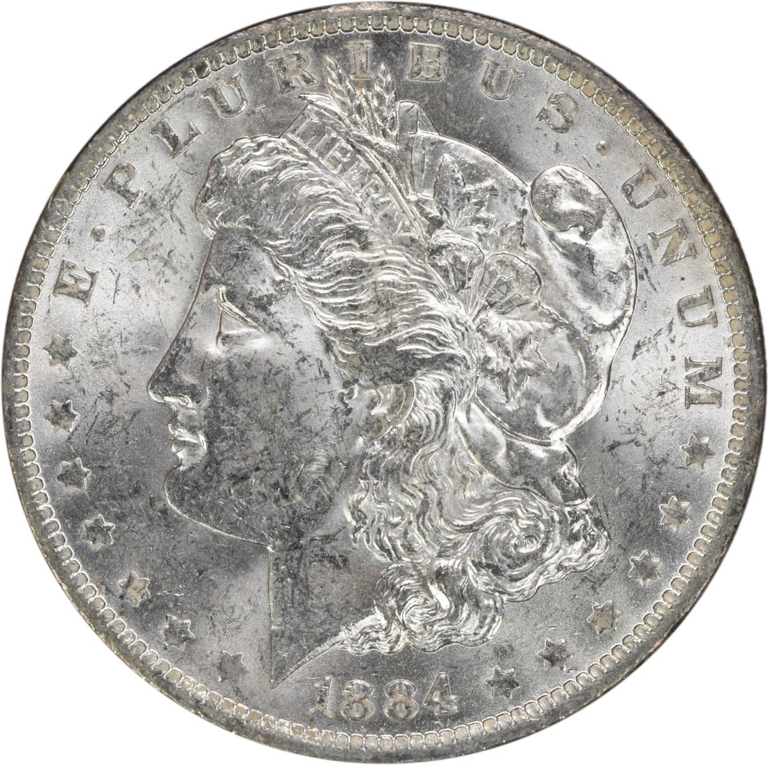 Uncirculated 1884 O Morgan Dollar Silver Coin Brilliant Uncertified: Uncirculated 1884 O Morgan Dollar Silver Coin Brilliant Uncertified This 1884-O Morgan Silver Dollar is a Brilliant Uncirculated (BU) coin from the New Orleans Mint. Composed of silver, it remains unc