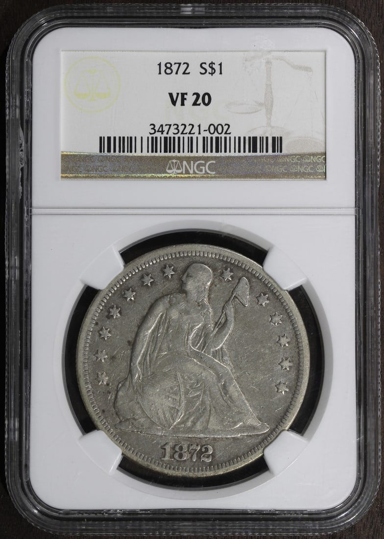 NGC VF20 1872 Seated Liberty Silver Dollar With Motto: NGC VF20 1872 Seated Liberty Silver Dollar With Motto An 1872 Seated Liberty Dollar $1 graded VF20 by NGC. This pre-owned coin is composed of silver with 0.9 fineness and features the With Motto varie