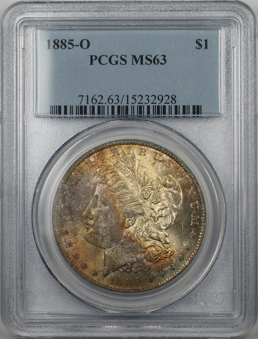 PCGS MS 63 1885-O Morgan Dollar New Orleans Mint Silver Toned: PCGS MS 63 1885-O Morgan Dollar New Orleans Mint Silver Toned This is an 1885-O Morgan Silver Dollar, graded MS 63 by PCGS. Minted in New Orleans, this uncirculated coin is composed of 90% silver and 