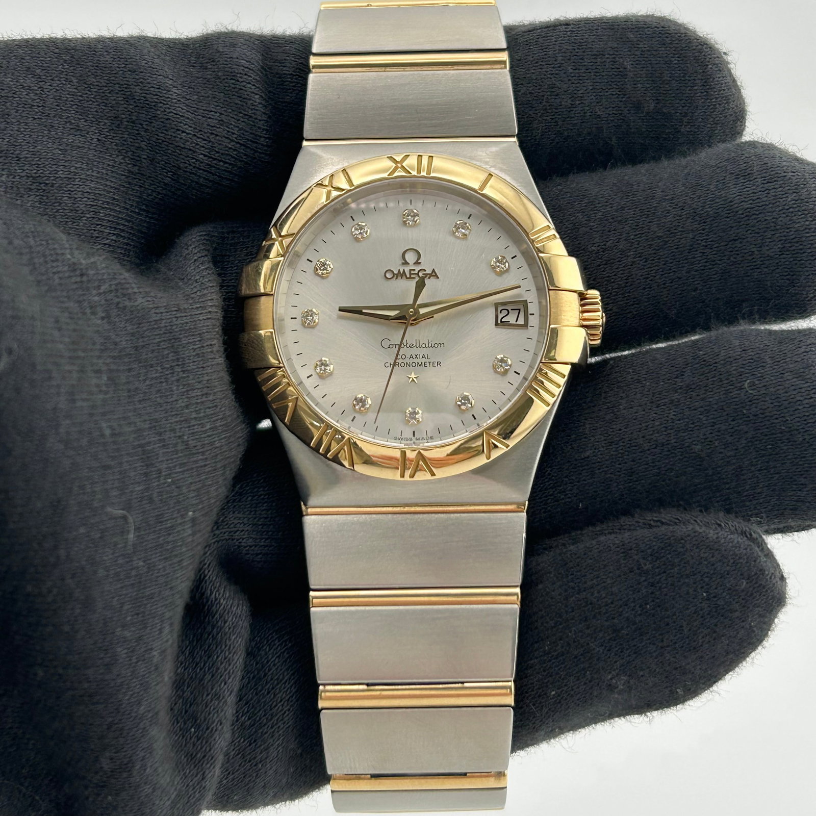 Omega Ref 123.20.35.20.52.002 Constellation Watch Silver Diamond Dial: Omega Ref 123.20.35.20.52.002 Constellation Watch Silver Diamond Dial Omega Constellation watch with a silver diamond dial and Roman bezel. The listing identifies it as a unisex model from the Constel