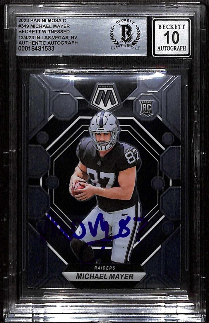 Michael Mayer Signed 2023 Panini Mosaic Rookie Football Card Beckett Auto 10: Michael Mayer Signed 2023 Panini Mosaic Rookie Football Card Beckett Auto 10 This is an original 2023 Panini Mosaic #349 sports trading card featuring Las Vegas Raiders rookie tight end Michael Mayer.