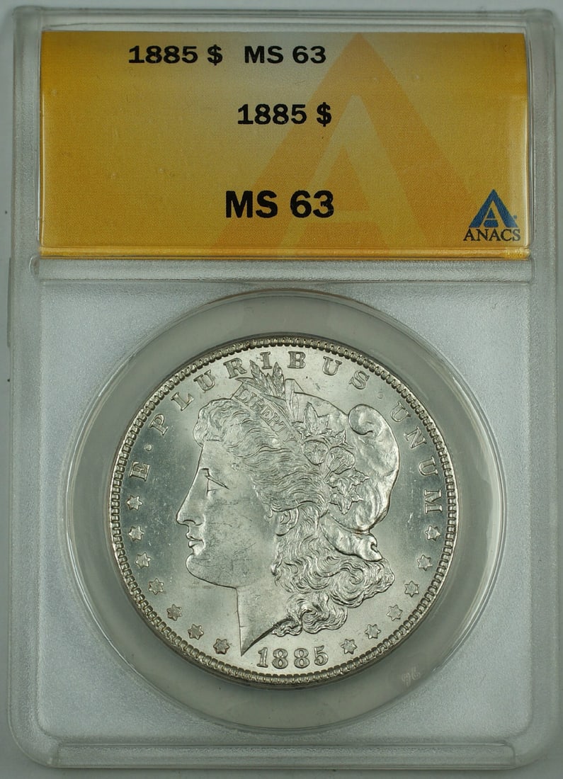ANACS MS 63 1885 Morgan silver dollar Philadelphia mint: ANACS MS 63 1885 Morgan silver dollar Philadelphia mint This 1885 Morgan Silver Dollar is graded MS-63 by ANACS, indicating a well-preserved uncirculated coin. Struck in Philadelphia, it features the 