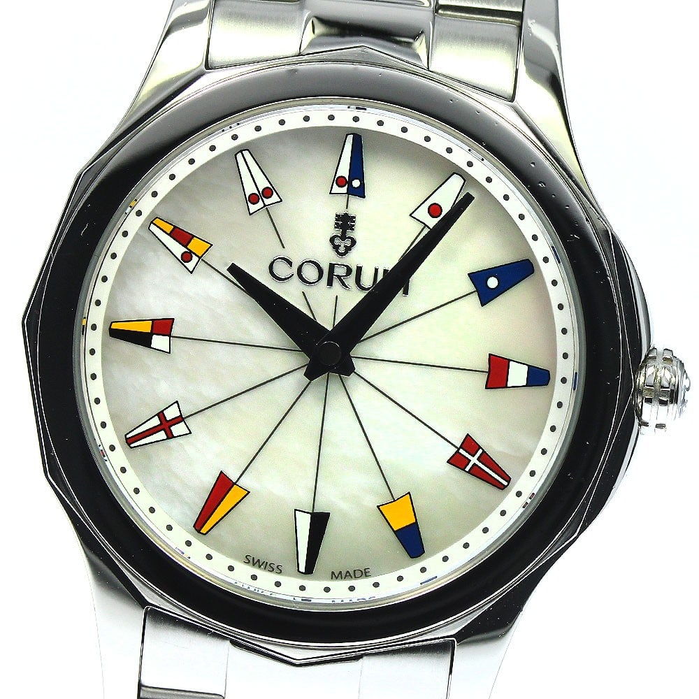 CORUM Admiral's Cup Quartz Ladies Stainless Steel Watch 01.0132: CORUM Admiral's Cup Quartz Ladies Stainless Steel Watch 01.0132 This pre-owned CORUM Admiral's Cup women's wristwatch features a stainless steel case and bracelet with a white mother-of-pearl dial. Po