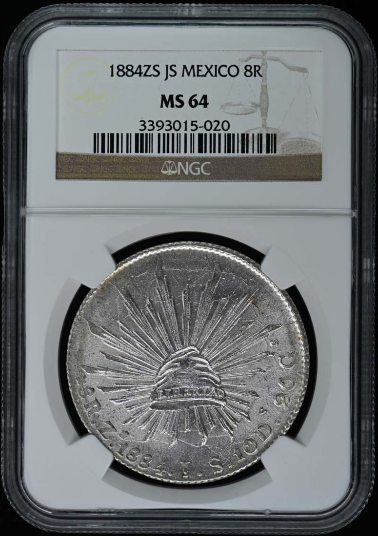 1884 Mexico 8 Reales Coin NGC MS64 Uncirculated: 1884 Mexico 8 Reales Coin NGC MS64 Uncirculated This stunning 1884 Mexican 8 Reales coin is graded as MS64 by NGC, signifying its uncirculated condition. The coin features intricate designs and is an 