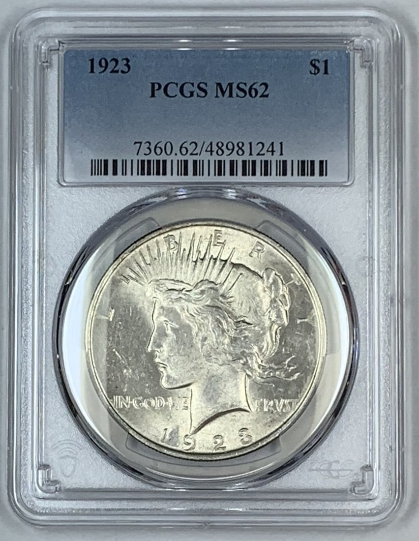PCGS MS 62 Certified 1923 Peace Silver Dollar Uncirculated Coin: PCGS MS 62 Certified 1923 Peace Silver Dollar Uncirculated Coin This 1923 Peace Silver Dollar coin is graded MS 62 by PCGS and remains uncirculated. It features a silver composition and was issued in 