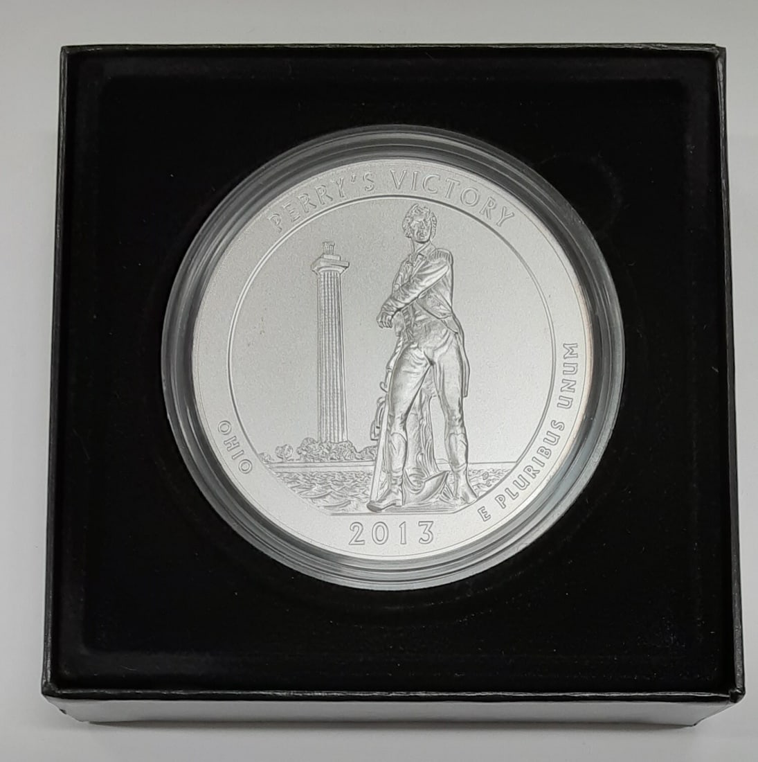 2013-P 5 Oz Silver Perry's Memorial ATB Quarter in Mint Packaging with COA: 2013-P 5 Oz Silver Perry's Memorial ATB Quarter in Mint Packaging with COA This is a 2013-P Perry's Victory and International Peace Memorial America the Beautiful (ATB) 5 ounce silver coin. Struck by 