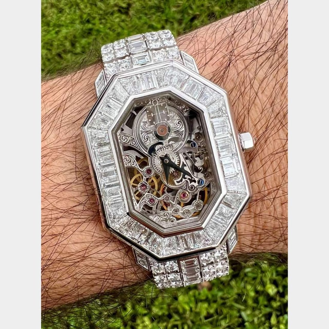 Corum Octagonale 18K White Gold Diamond Watch Box Booklet: Corum Octagonale 18K White Gold Diamond Watch Box Booklet This Corum Octagonale watch is crafted from 18K white gold and features an impressive array of diamonds. The timepiece is set with 85 baguette