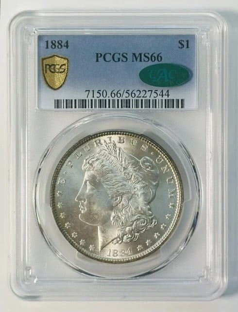 PCGS MS-66 CAC 1884 Morgan Silver Dollar: PCGS MS-66 CAC 1884 Morgan Silver Dollar 1884 Morgan Silver Dollar certified by PCGS and CAC, graded MS 66. This pre-owned U.S. dollar coin was minted in Philadelphia and is composed of silver. The ce
