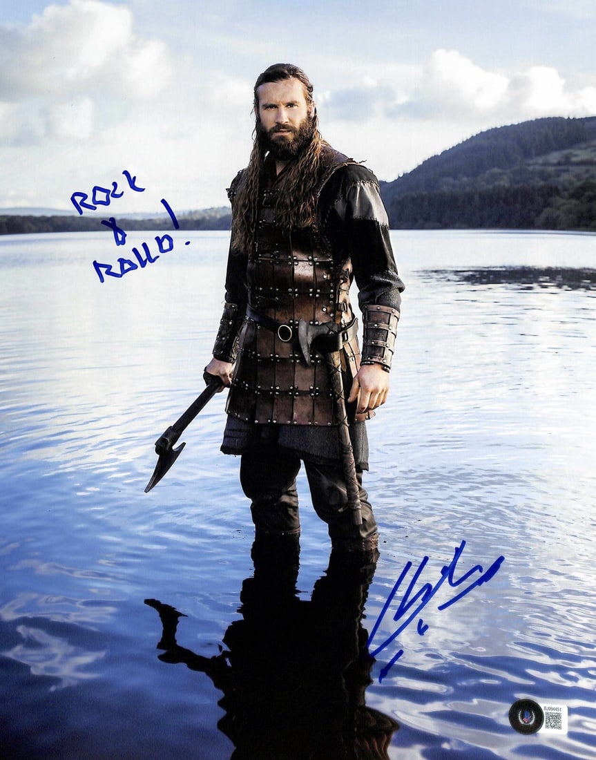 Vikings Rollo 11x14 Photo Signed by Clive Standen Beckett Authenticated: Vikings Rollo 11x14 Photo Signed by Clive Standen Beckett Authenticated This 11x14 photograph features an authentic signature in blue permanent marker by Clive Standen, who portrayed "Rollo" in the te