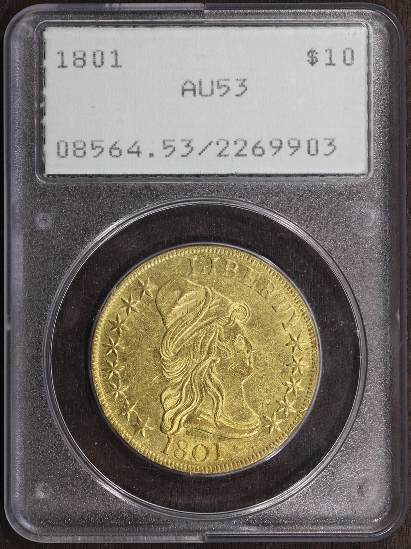 AU53 1801 $10 Capped Bust Gold Coin Certified by PCGS: AU53 1801 $10 Capped Bust Gold Coin Certified by PCGS This is an 1801 Capped Bust Gold Eagle $10 coin, graded AU53 by PCGS. The coin is circulated and was minted in Philadelphia before 1933. Composed 