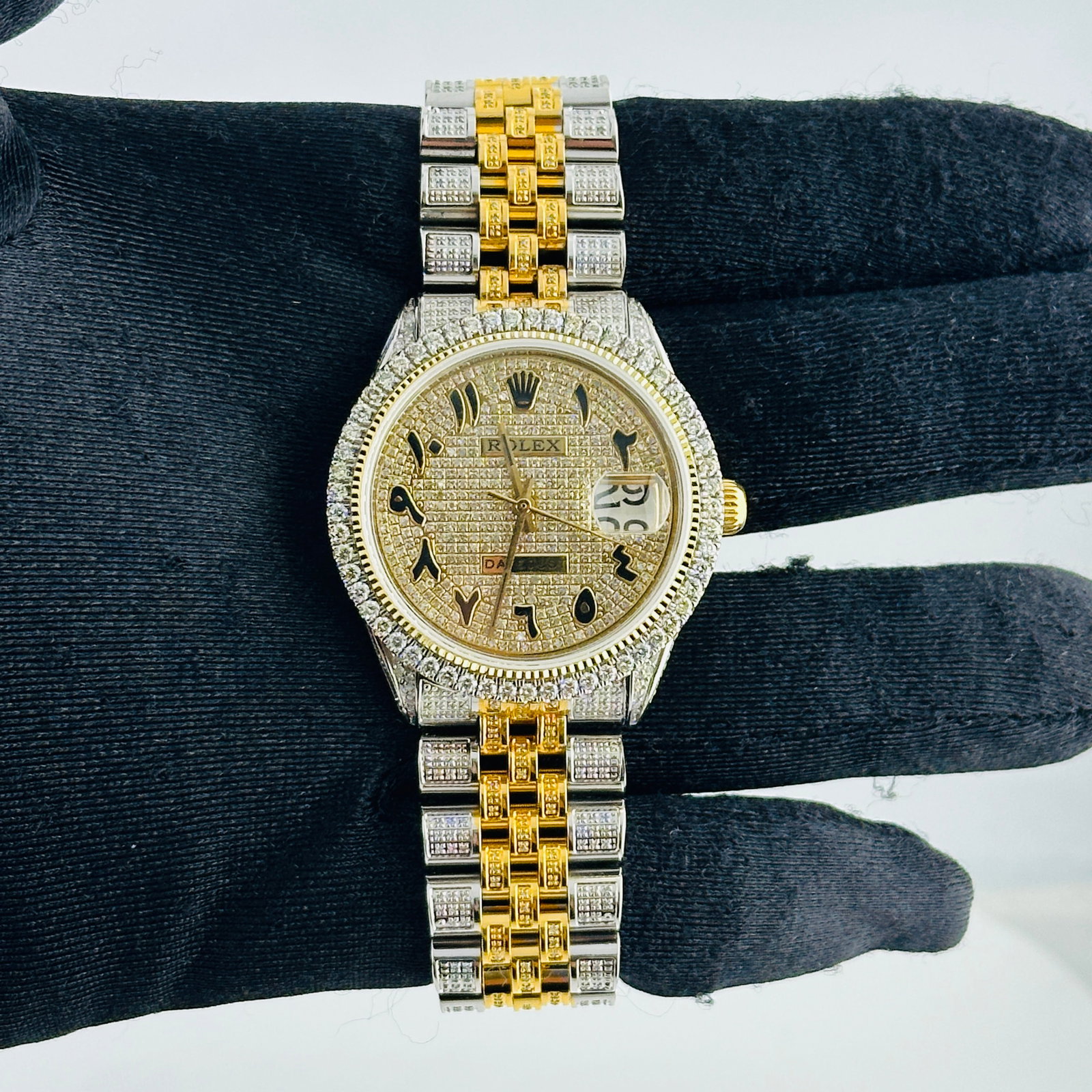 Rolex Aftermarket Diamond Jubilee Hidden Clasp Watch Ref 6694 with Diamond Arabic Dial: Rolex Aftermarket Diamond Jubilee Hidden Clasp Watch Ref 6694 with Diamond Arabic Dial This Rolex Date wristwatch features a diamond-set Arabic dial and a prong-set diamond-plated bezel. The bracelet 